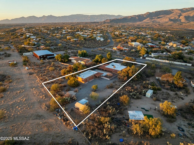 birds eye view of property with a mountain view