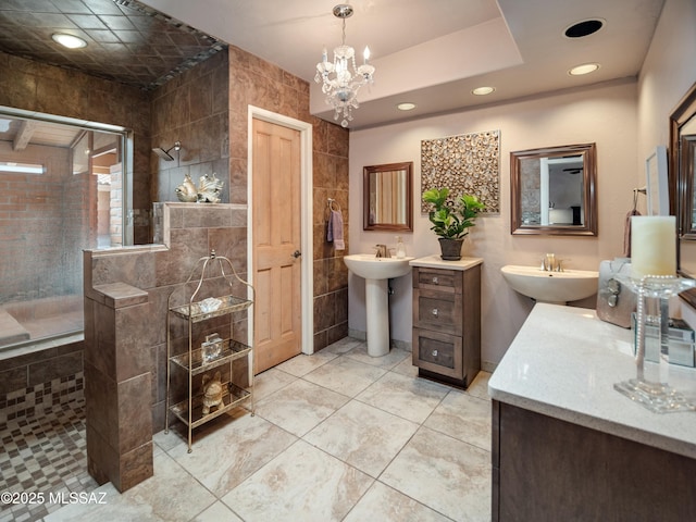 full bath with tile walls, a tile shower, two sinks, and recessed lighting