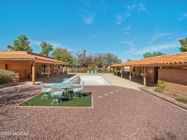 view of home's community with a patio and a swimming pool