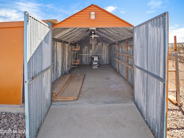 view of outbuilding featuring a carport, an outbuilding, and an exterior structure