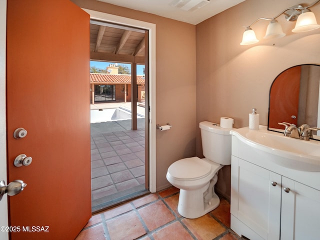 bathroom with visible vents, vanity, and toilet