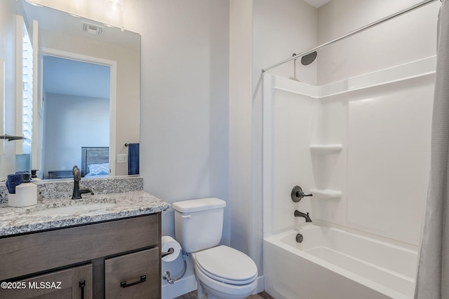 full bathroom with shower / bath combination with curtain, vanity, and toilet