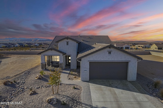 view of front of property with a garage