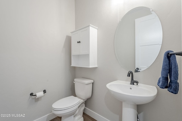 bathroom featuring sink and toilet