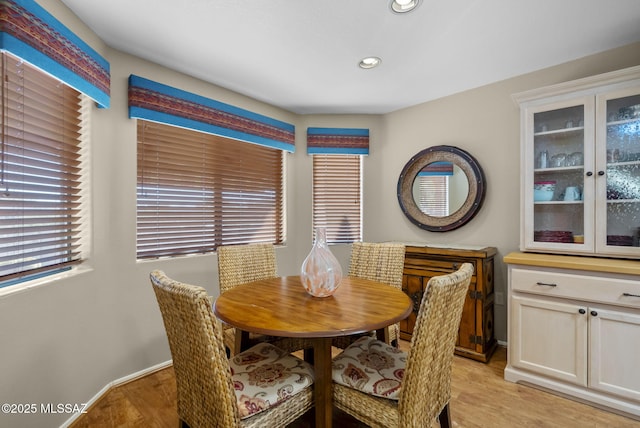 dining area featuring light wood-type flooring