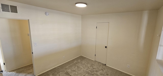 interior space featuring light colored carpet