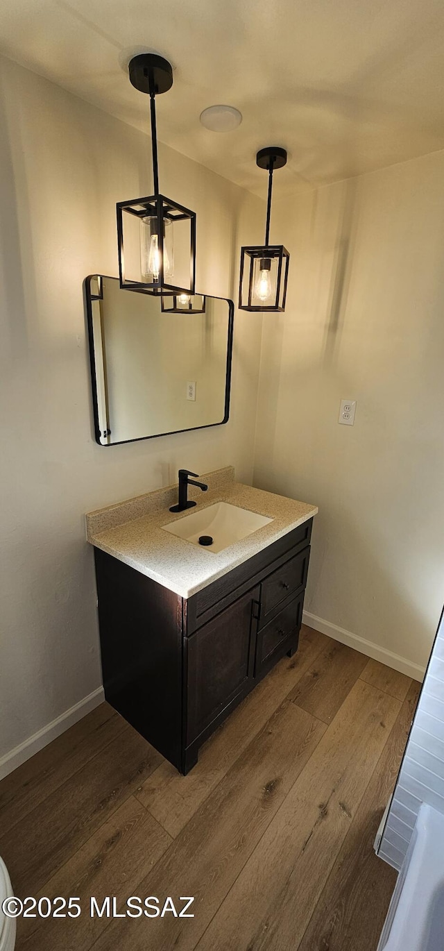 bathroom with wood-type flooring and vanity