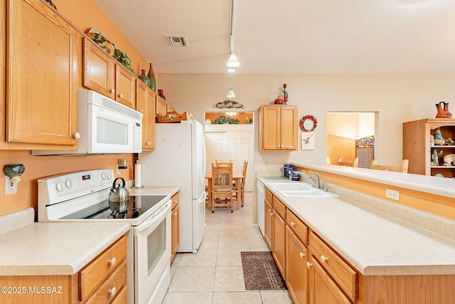 kitchen featuring decorative light fixtures, sink, light tile patterned floors, kitchen peninsula, and white appliances