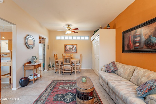 tiled living room featuring ceiling fan