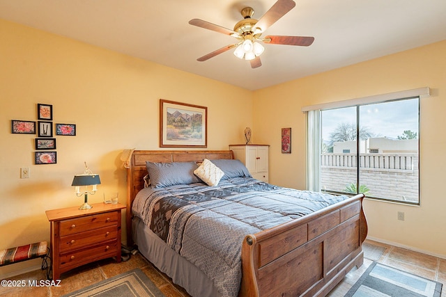 bedroom featuring ceiling fan and access to outside