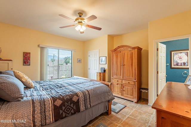 bedroom with ceiling fan and access to exterior