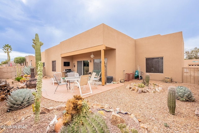 back of property featuring a patio area