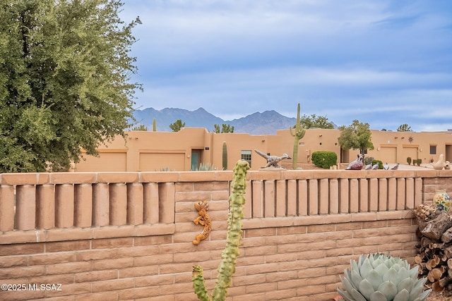 view of gate with a mountain view