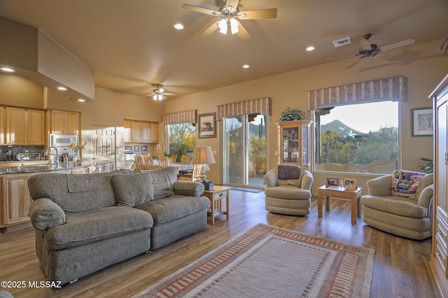 living room featuring wood finished floors, visible vents, a toaster, recessed lighting, and ceiling fan
