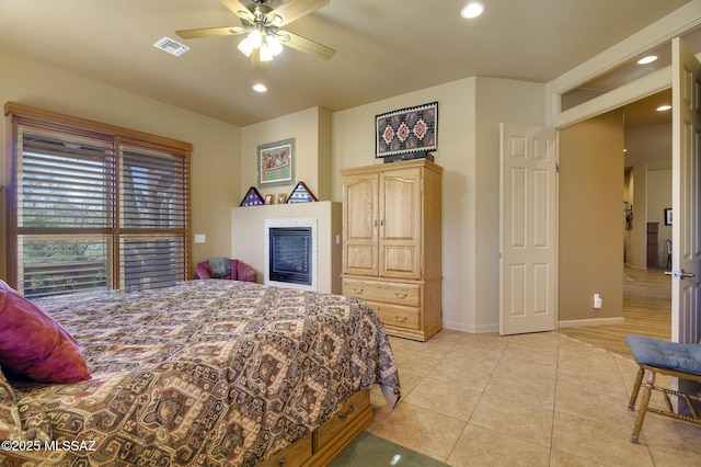 bedroom featuring light tile patterned floors, visible vents, baseboards, recessed lighting, and ceiling fan