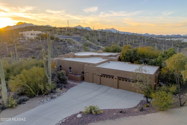 drone / aerial view featuring a mountain view