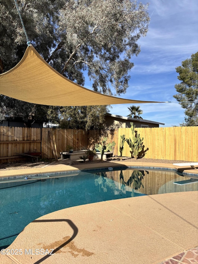 view of pool featuring a fenced in pool and a fenced backyard