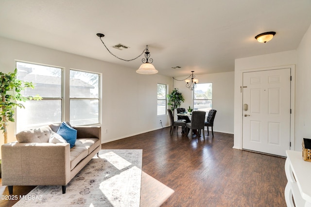 interior space featuring hardwood / wood-style floors and a chandelier