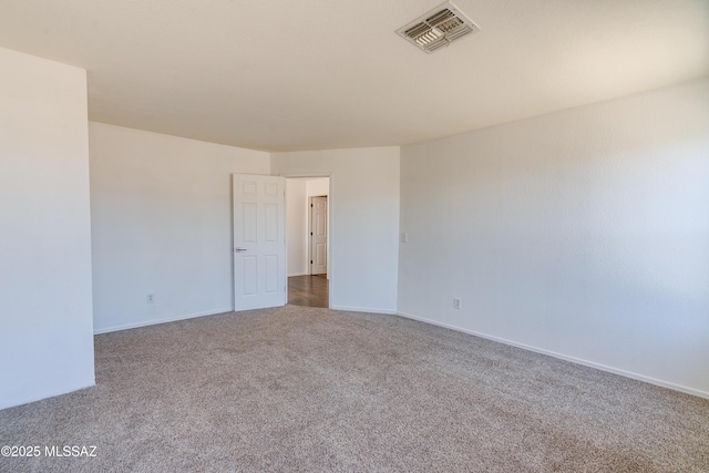 empty room featuring carpet flooring