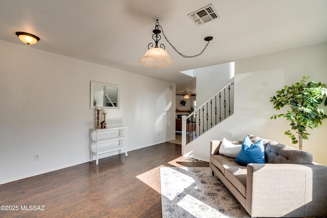 living room with dark hardwood / wood-style floors