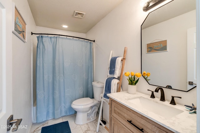 full bathroom featuring vanity, shower / tub combo, and toilet