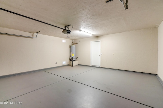 garage with a garage door opener and water heater