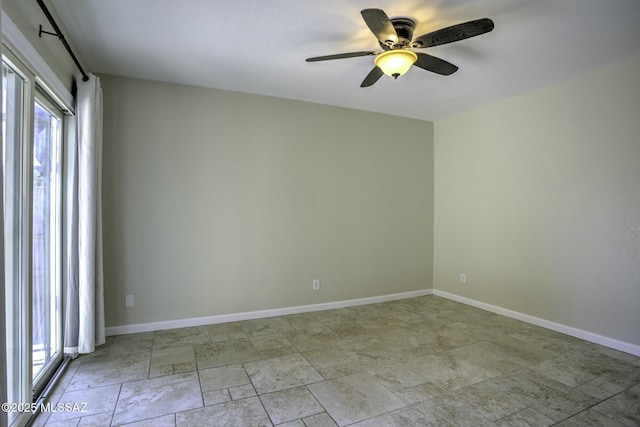 spare room with ceiling fan