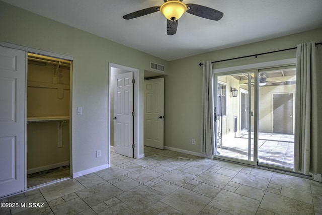 unfurnished bedroom featuring access to exterior, a closet, and ceiling fan