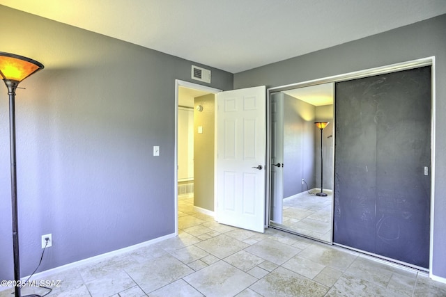 unfurnished bedroom featuring a closet