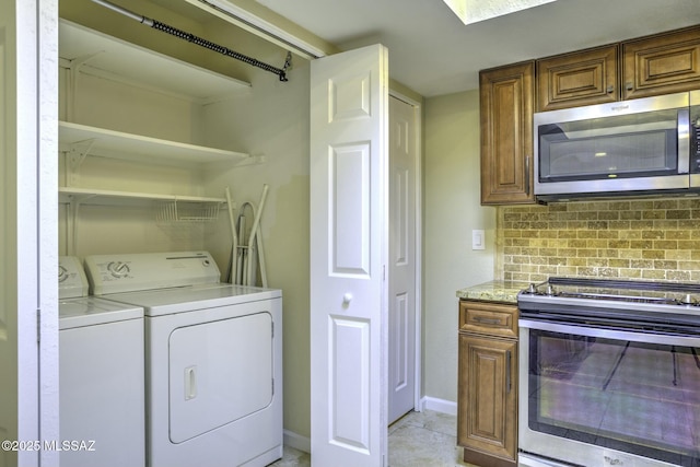 laundry area with washer and dryer