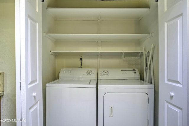 clothes washing area with washer and dryer