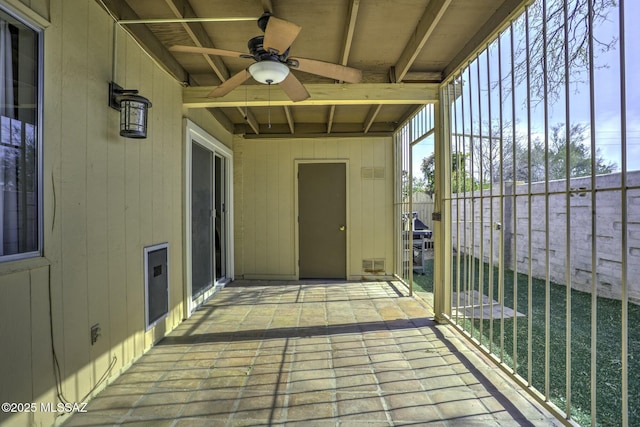 wooden deck with ceiling fan and a patio area