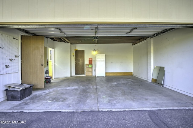 garage with white refrigerator