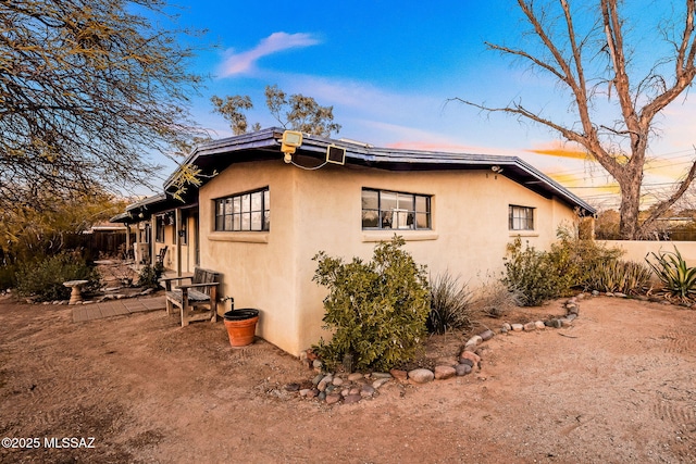 view of property exterior at dusk