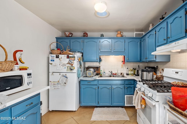 kitchen featuring tasteful backsplash, sink, white appliances, and blue cabinets