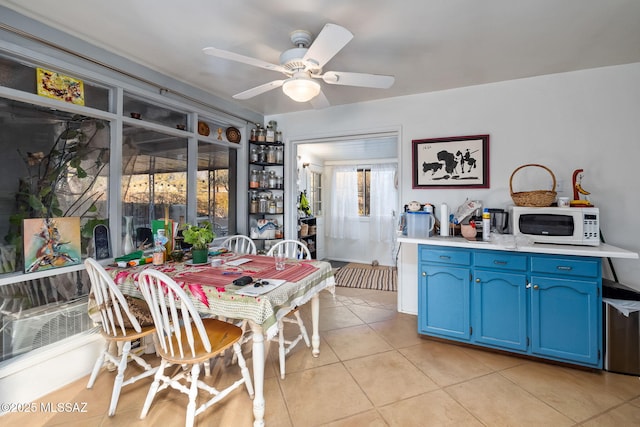 dining room featuring ceiling fan and light tile patterned floors