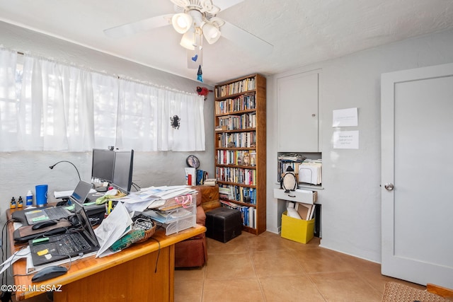 office with ceiling fan and light tile patterned flooring