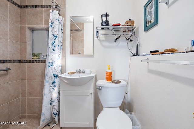 bathroom with vanity, toilet, and curtained shower