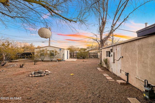 yard at dusk with an outdoor structure