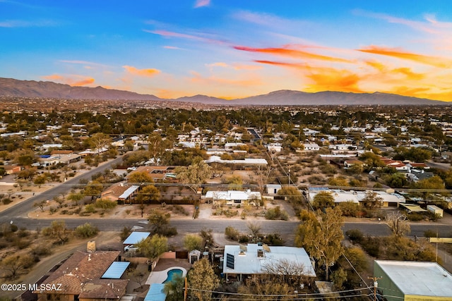 aerial view at dusk with a mountain view