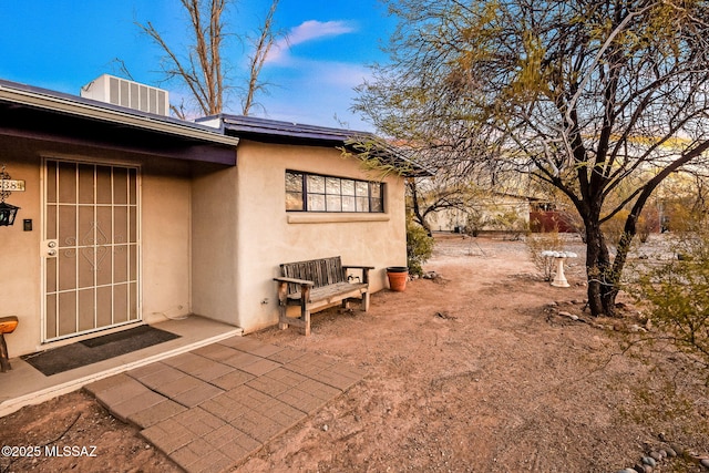 view of property exterior with a patio area