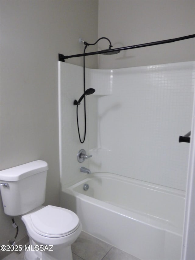 bathroom with  shower combination, tile patterned flooring, and toilet