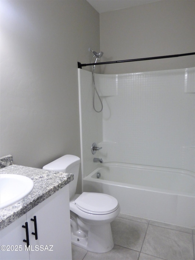 bathroom featuring shower / bath combination, vanity, toilet, and tile patterned floors