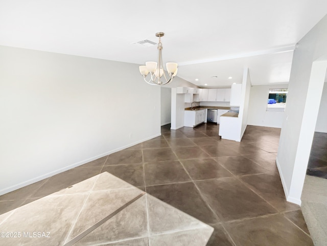 dining area featuring sink and a notable chandelier