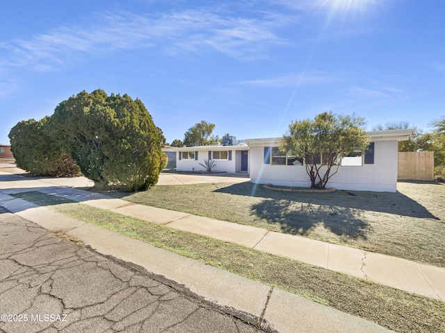 view of front of home with a front lawn