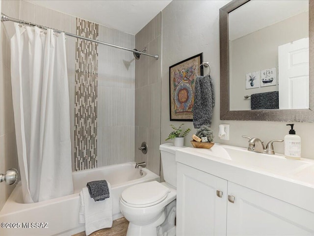 full bathroom with vanity, shower / bath combination with curtain, and toilet