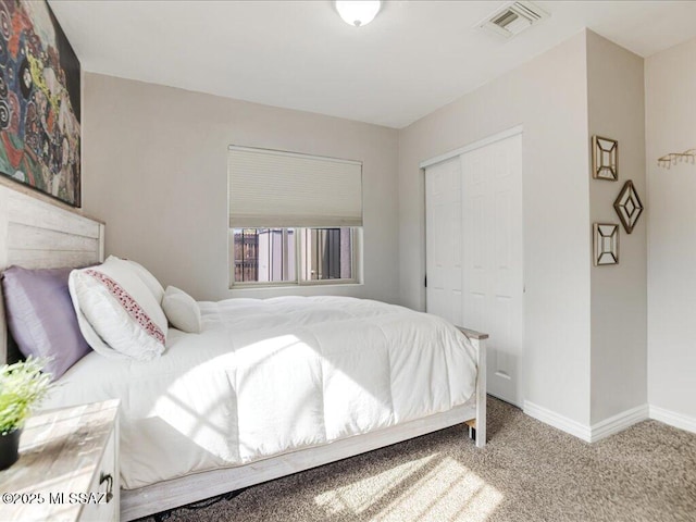 bedroom with light colored carpet and a closet