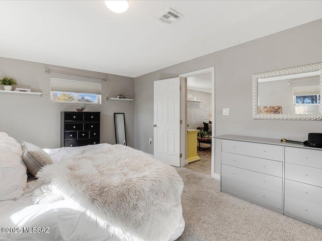 bedroom with light colored carpet