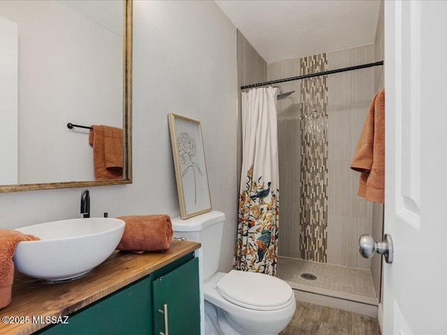 bathroom with vanity, toilet, and walk in shower