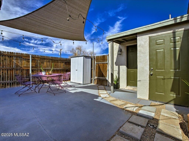 view of patio / terrace with a shed